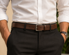Leather belt on neutral backdrop