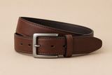Leather belt on neutral backdrop
